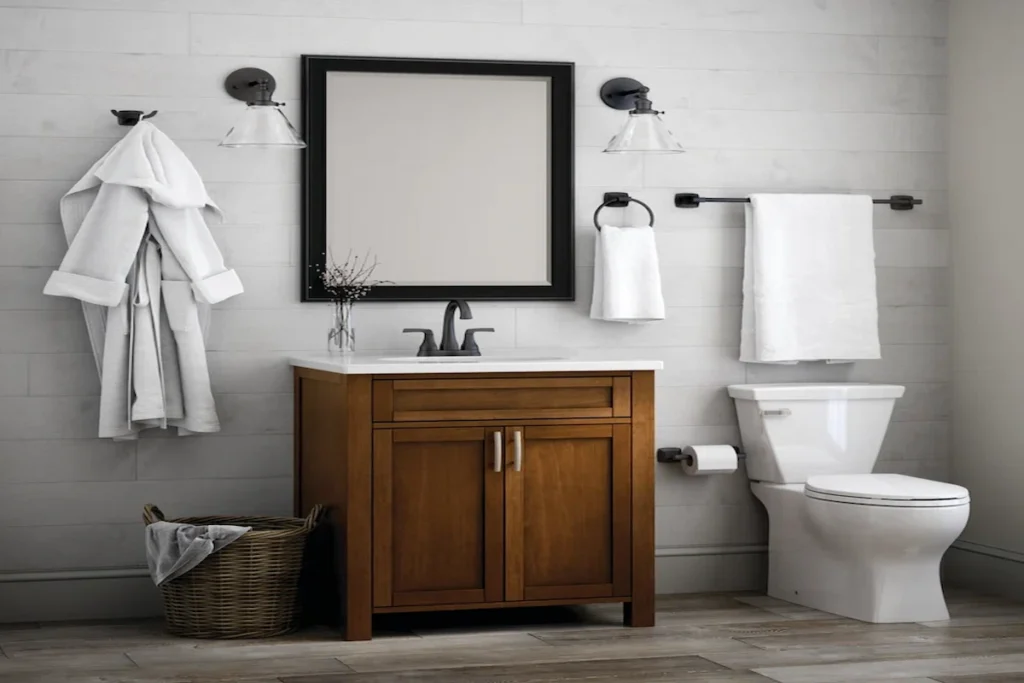 A modern farmhouse bathroom with a wooden vanity, black-framed mirror, white shiplap walls, and matte black fixtures.