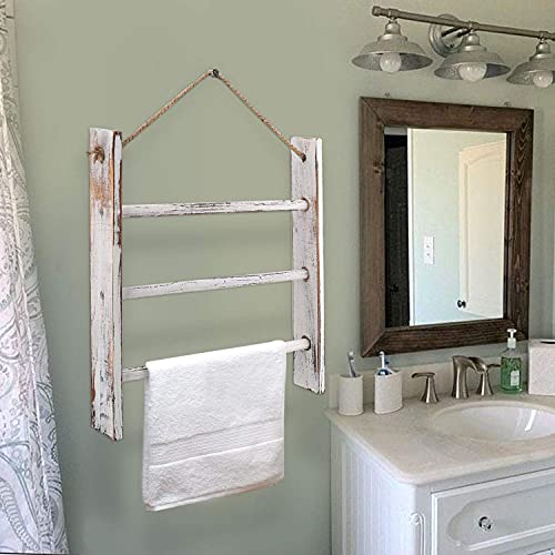 CuffUp whitewashed wood ladder towel rack hanging by rope in a bathroom